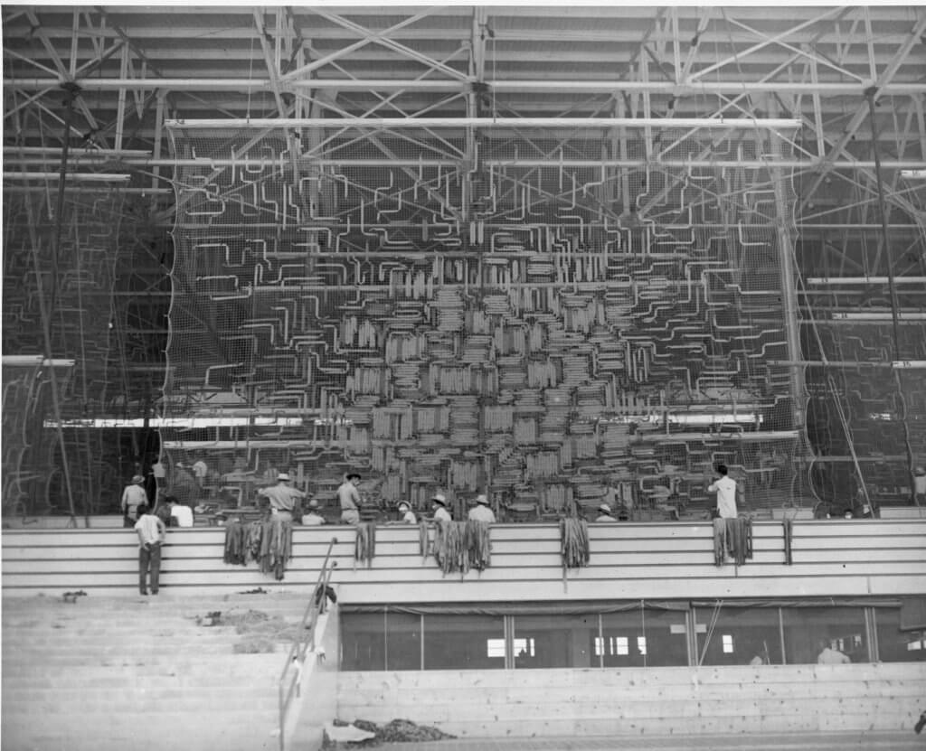 Figure 12 A group of Japanese Americans working at the camouflage net factory at the Santa Anita detention center, by the US Army Signal Corps (1942). (Courtesy of the Library of Congress.)